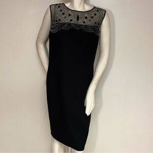 Black sleeveless, knee-length dress with beaded bodice